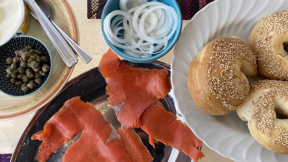 Lunchtime bagels with smoked salmon, onions, capers and cream cheese