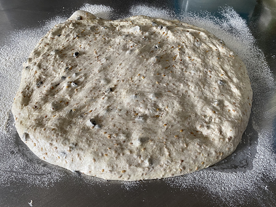Dough stretched out on the counter