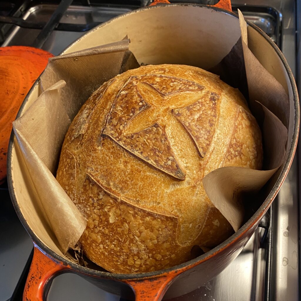 Baked loaf in an orange Le Creuset casserole